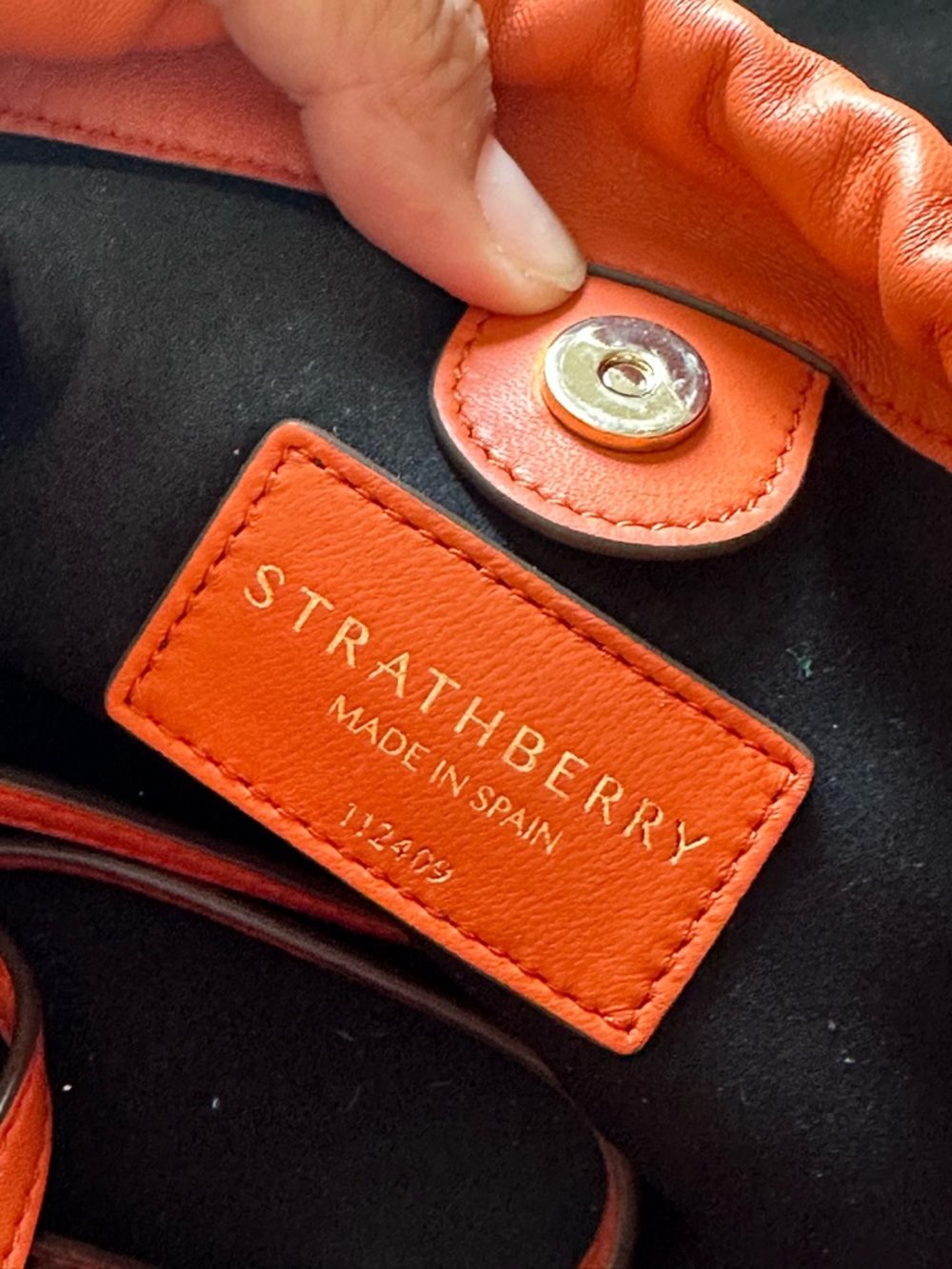 Strathberry Charlotte Orange Leather Drawstring Mini Pouch with Gold Accents - Picture 3 of 5